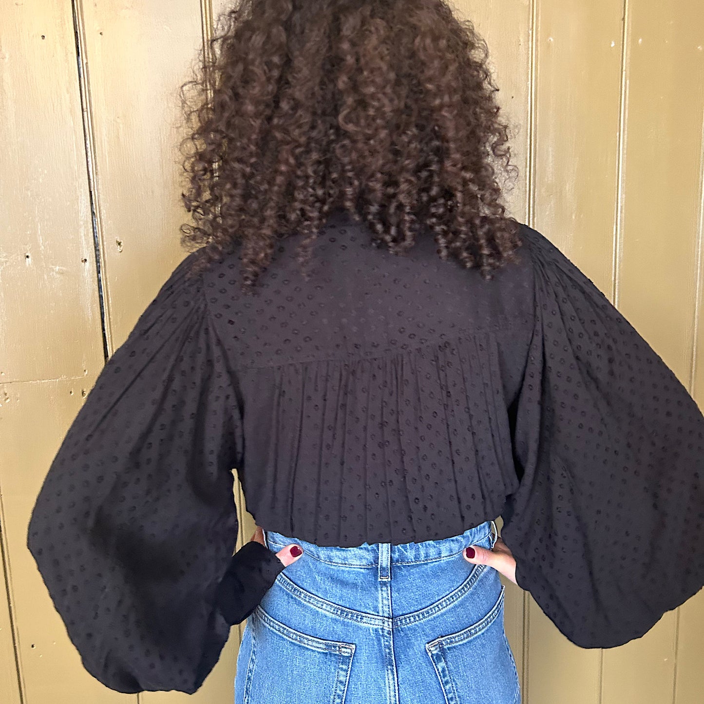 Betsy Bow Blouse in black viscose self spot.