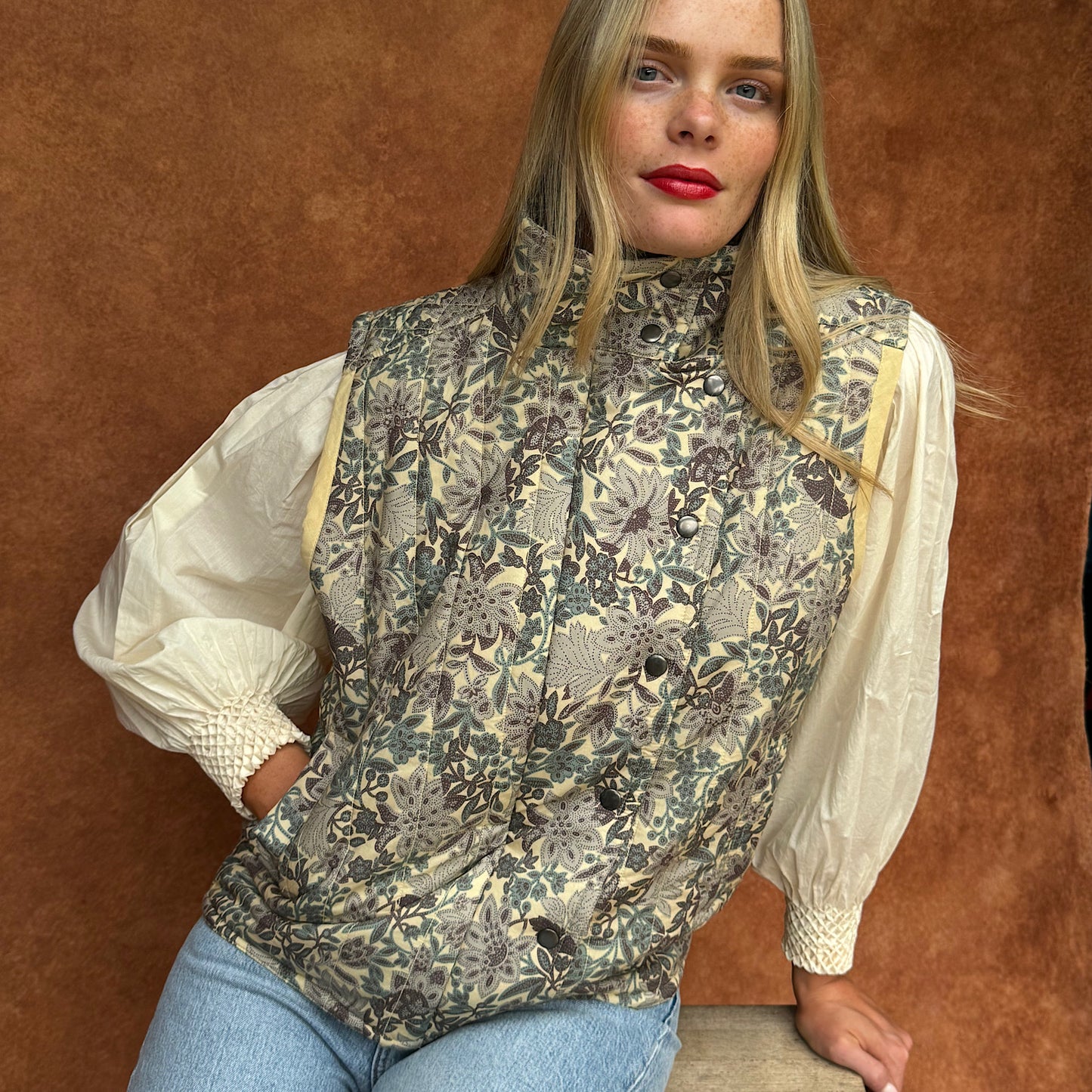 Quilted Frida sleeveless jacket in woodland floral print cotton lawn.