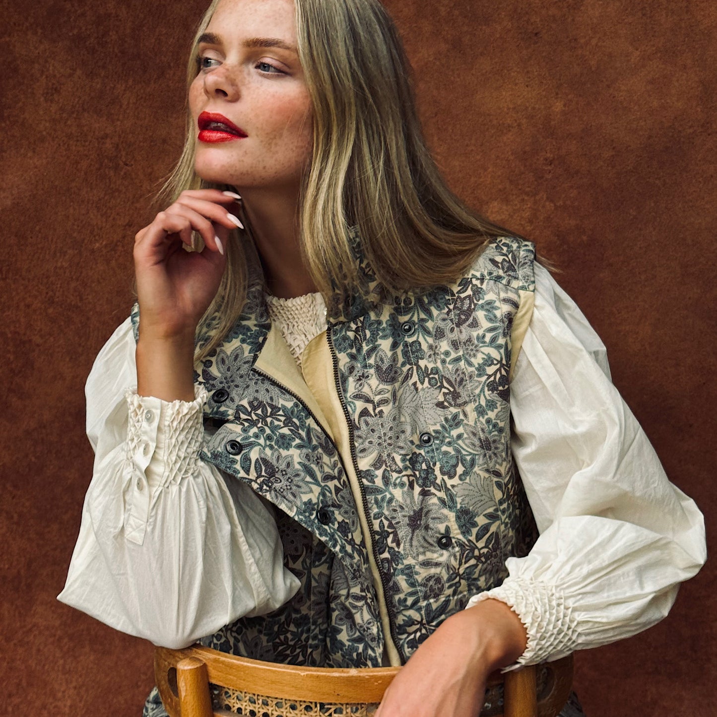 Quilted Frida sleeveless jacket in woodland floral print cotton lawn.