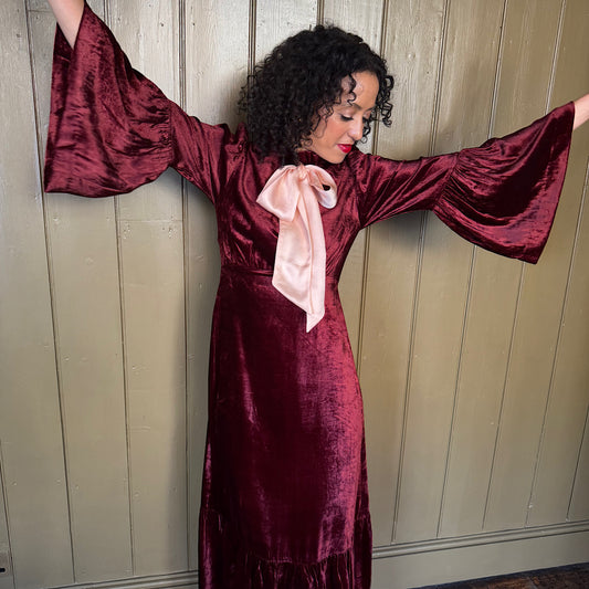 Ophelia dress in burgundy velvet with ballet pink satin tie.