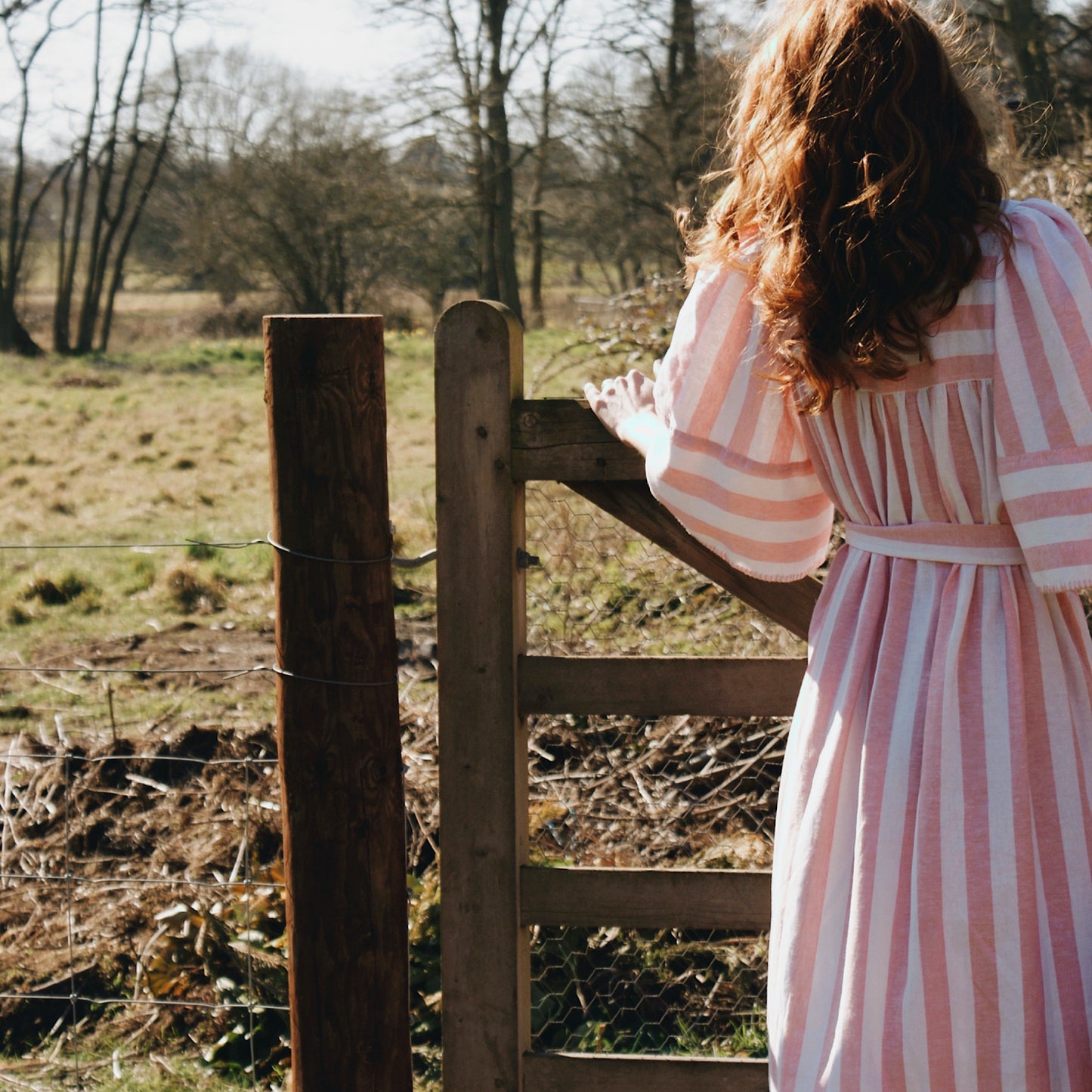 Margot dress in candy striped cotton with angel sleeves and tie belt.
