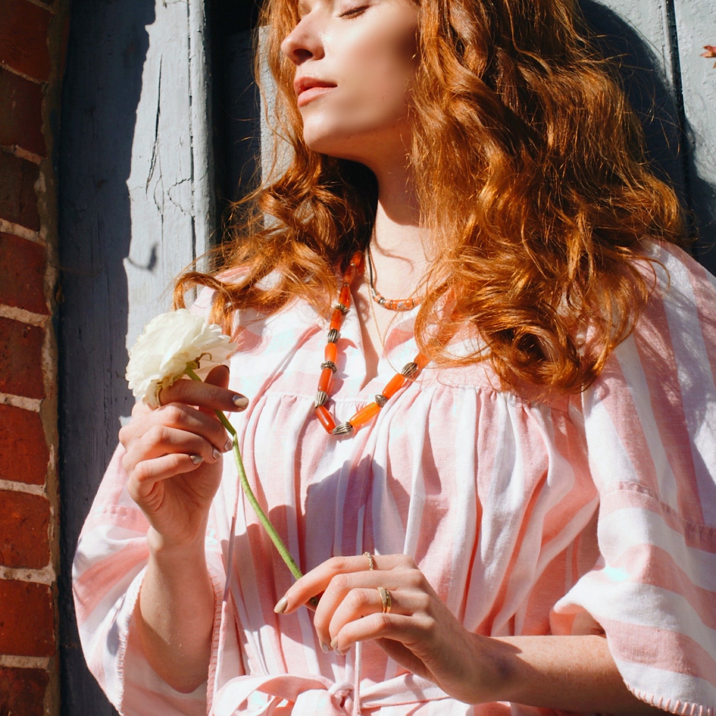 Margot dress in candy striped cotton with angel sleeves and tie belt.