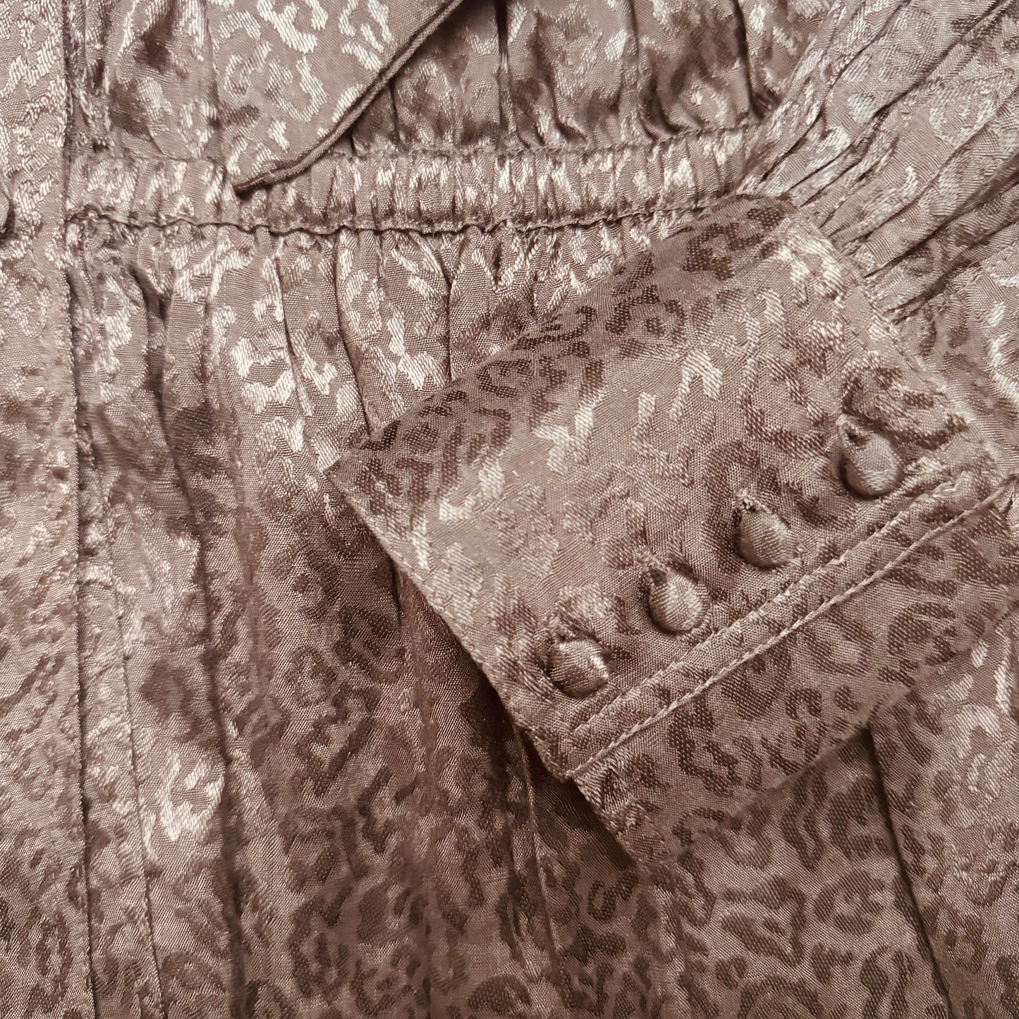 Delphi bow blouse in rich chocolate viscose with leopard jacquard design