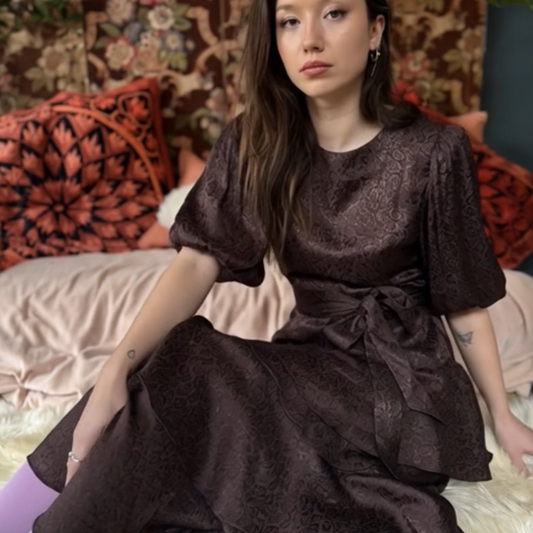 Lou-Lou dress in rich chocolate leopard print jacquard, with contrast belt and tiered skirt.