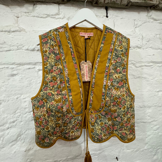 Stevie quilted waistcoat, summer meadow floral print in cotton lawn.