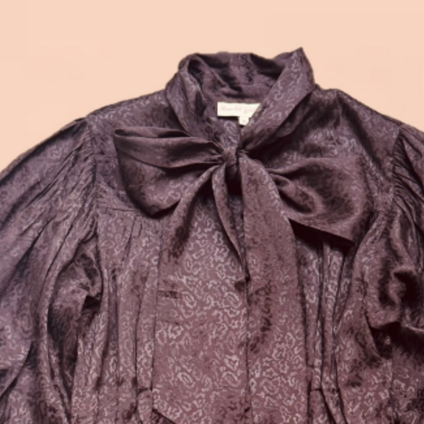 Delphi bow blouse in rich chocolate viscose with leopard jacquard design