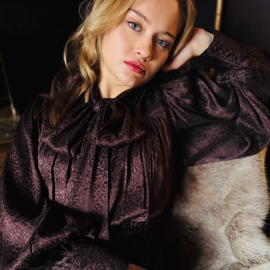 Delphi bow blouse in rich chocolate viscose with leopard jacquard design